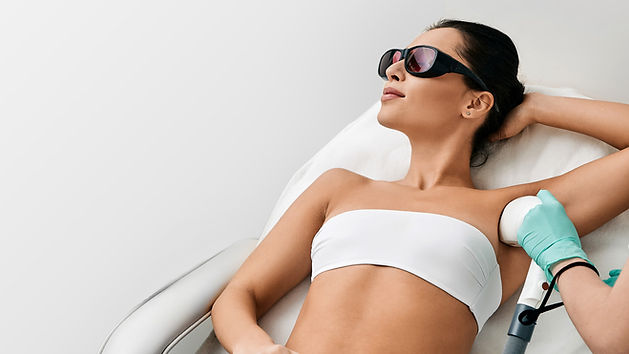 Process of laser hair removal on a woman's legs